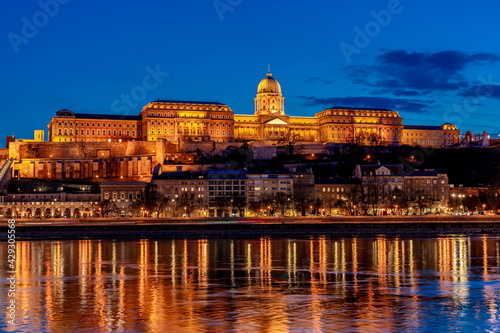 Hungary, Budapest at night, Buda Fortress illuminated by lights, reflected in the water