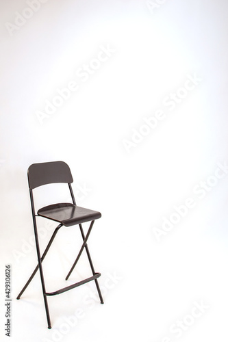black bar stool on white background in the studio
