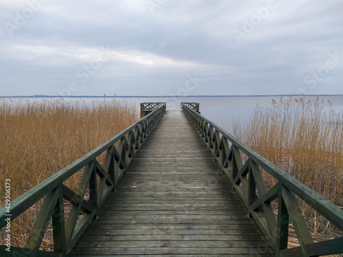 Pier on Leba lake in Slowinski national park, northern Poland (Baltic coast)