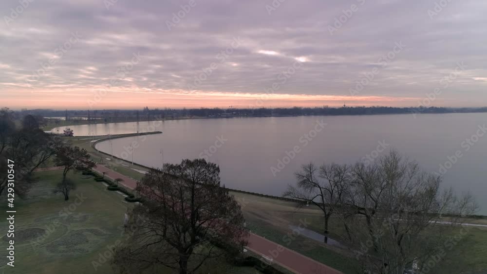 Lake shore of Lake Palic in Serbia Aerial drone shot. Beach houses and restaurants. Nice nature resort. Promenade near the lake. Lake shore of Lake Palic in Serbia Aerial drone shot. Beach houses and restaurants. Nice nature resort. Promenade near the lake.