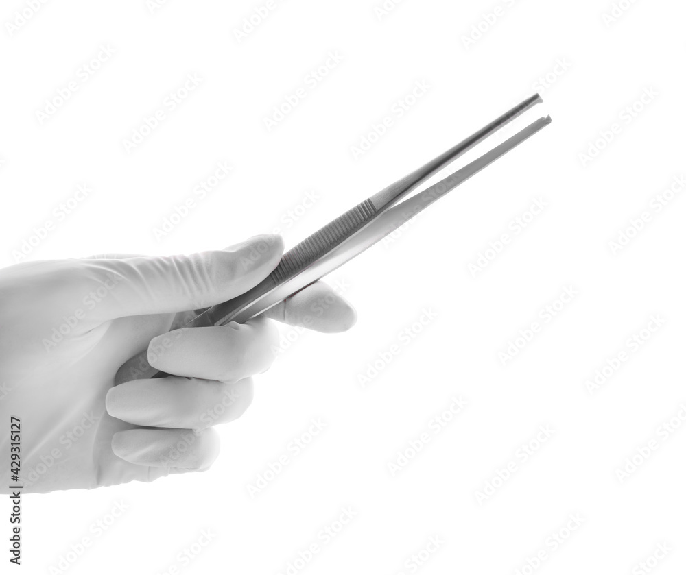 Doctor holding surgical forceps on white background, closeup. Medical instrument Doctor holding surgical forceps on white background, closeup. Medical instrument