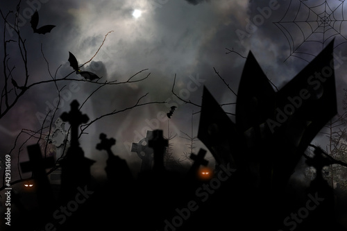 Old misty cemetery on full moon night