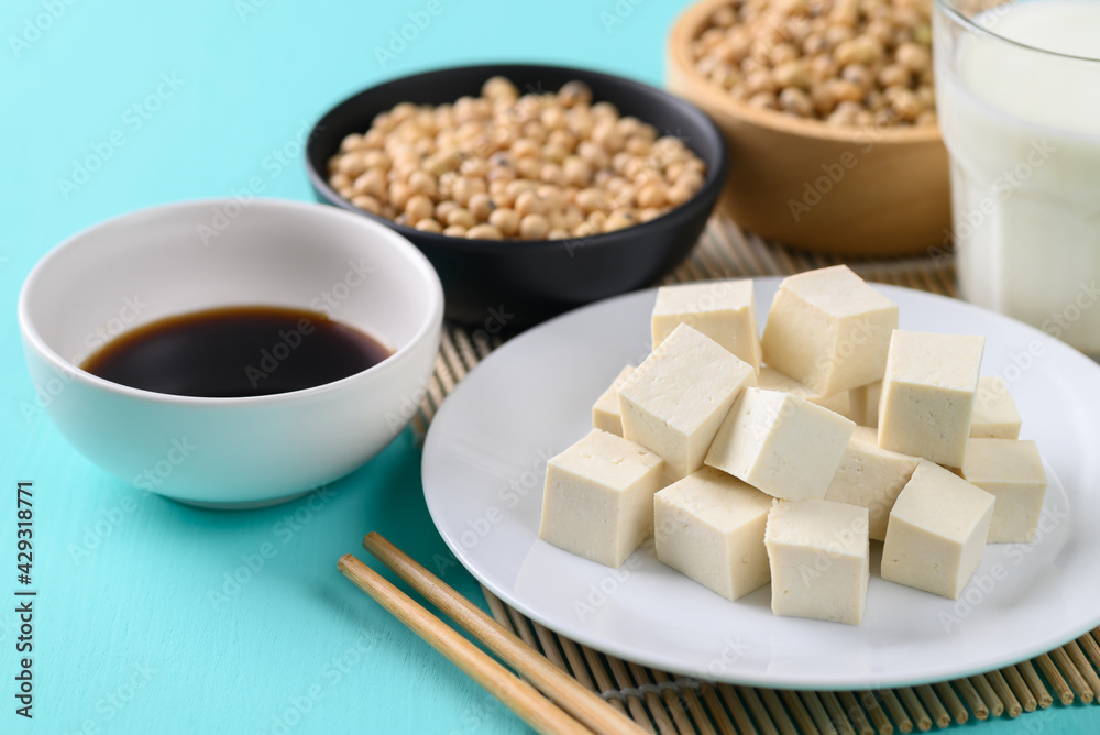 Sliced tofu, soybean seeds, soy milk and soy sauce, Healthy vegan food Sliced tofu, soybean seeds, soy milk and soy sauce, Healthy vegan food