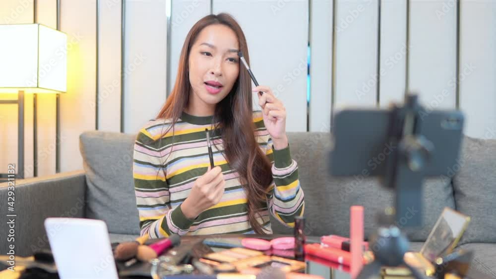 Woman Making Vlog about Cosmetics with Smartphone. Indoors, Slomo.