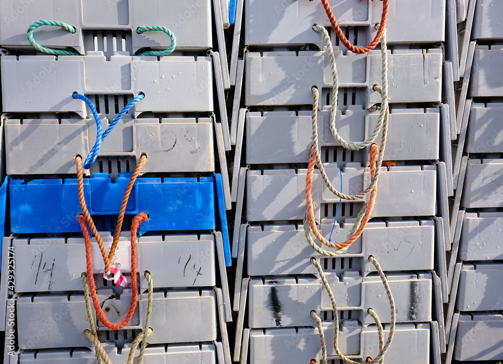 Ventilated lobster transport cages on a Maine Commercial dock