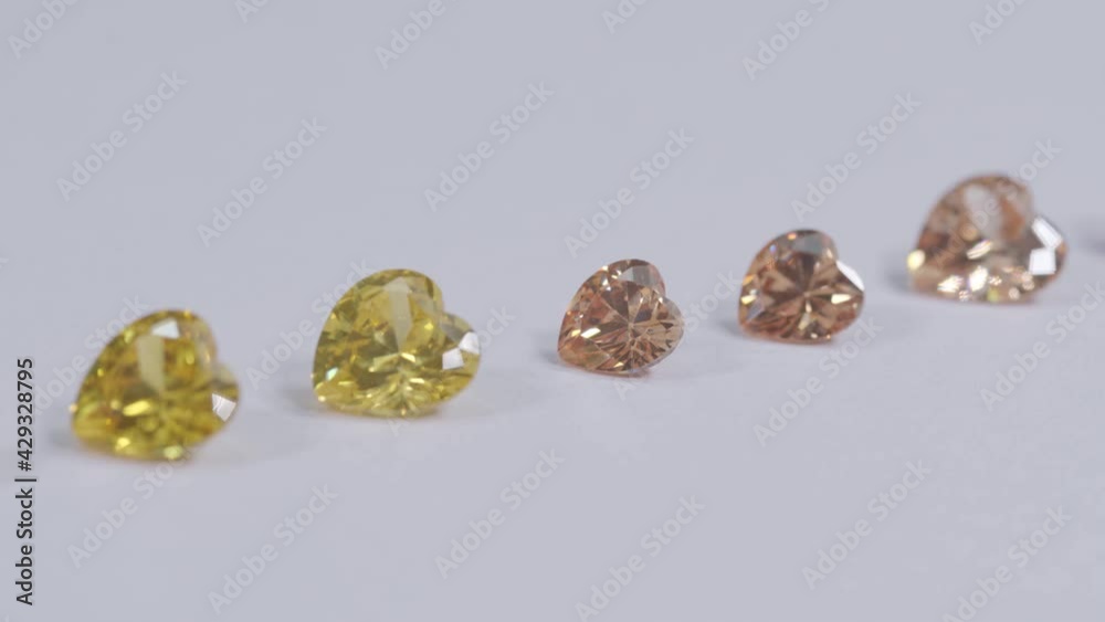 .colorful diamond in heart shape are placed in a row on white background, .colorful diamond in heart shape are placed in a row on white background,