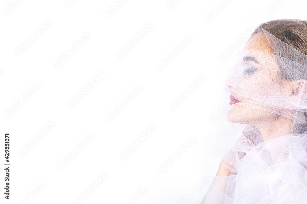Young adult beautiful woman model blonde portrait with tulle on her face Young adult beautiful woman model blonde portrait with tulle on her face