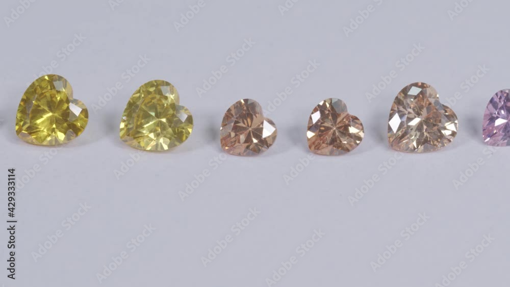.colorful diamond in heart shape are placed in a row on white background, .colorful diamond in heart shape are placed in a row on white background,