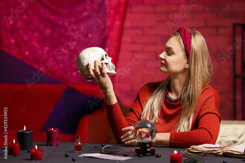 Fortune teller reading future at table photo