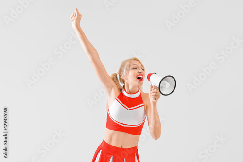 Beautiful cheerleader with ...