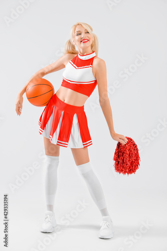 Beautiful cheerleader with ...