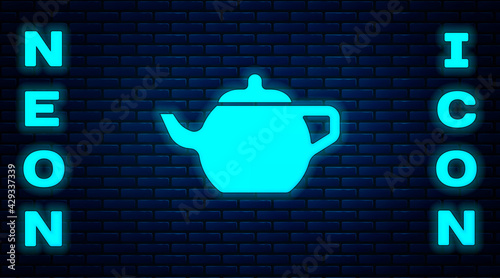 Glowing neon Traditional Chinese tea ceremony icon isolated on brick wall background. Teapot with cup. Vector