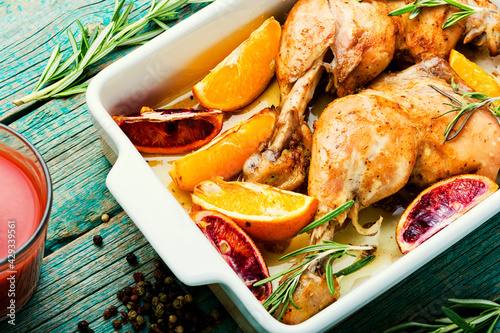 Roasted chicken with oranges photo