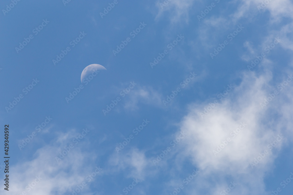 The white crescent moon in the afternoon cool white clouds on beautiful afternoon sky background Images for clear sky background design make you feel fresh and airy. The white crescent moon in the afternoon cool white clouds on beautiful afternoon sky background Images for clear sky background design make you feel fresh and airy.