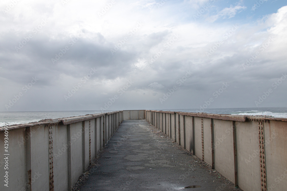 Metal Pedestrian Bridge with the Sea as a Backdrop
