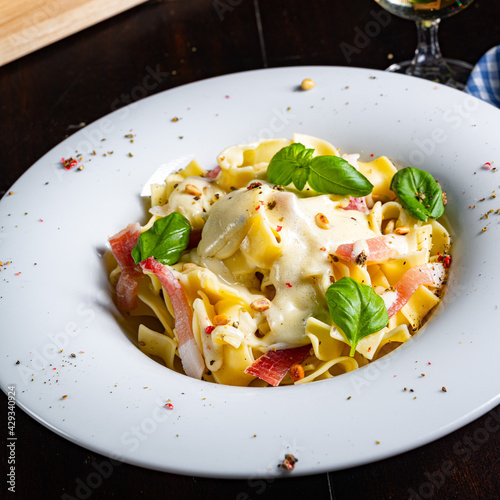 Tagliatelle with gorgonzola masarpone sauce and ham. photo