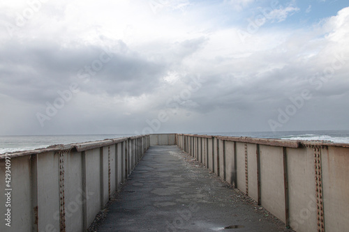 Metal Pedestrian Bridge with the Sea as a Backdrop © lcswart