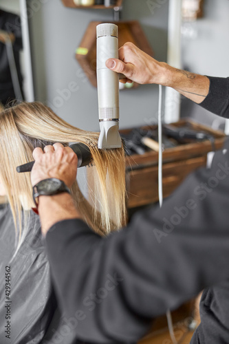 Hair drying process in modern hairdresser's salon