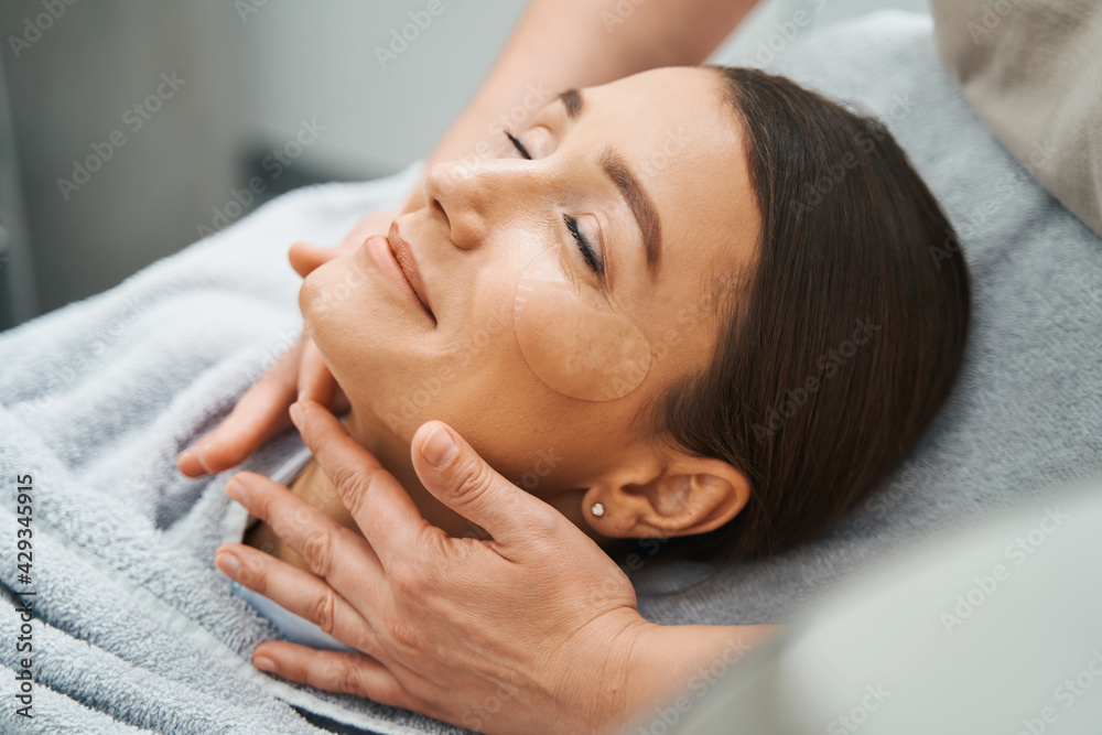 Beauty salon customer enjoying an anti-wrinkle treatment Beauty salon customer enjoying an anti-wrinkle treatment