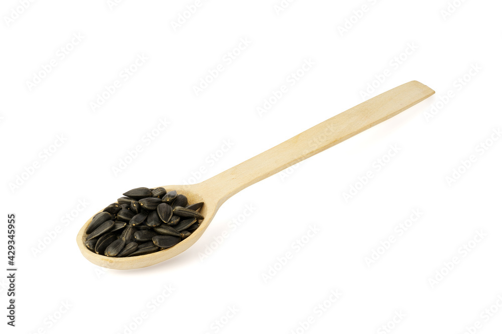 sunflower seeds in wooden spoon isolated on white background, sunflower seeds in wooden spoon isolated on white background,