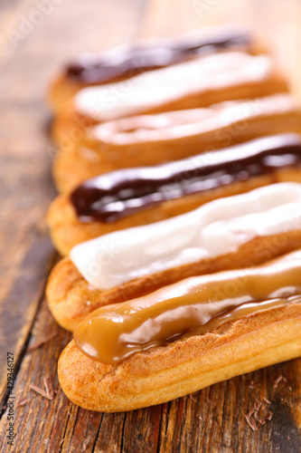 Obraz na płótnie french dessert- vanilla, coffee and chocolate eclair