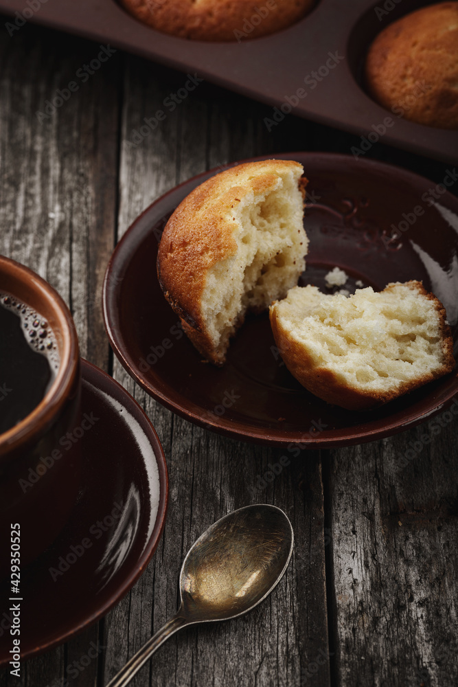 The concept of home baking. Fresh delicious muffins on the table. The concept of home baking. Fresh delicious muffins on the table.
