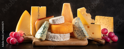 Cheese panorama with various types of cheeses, side view photo