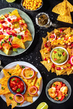 Nachos, tequila, and dips. Mexican food. A party, top shot
