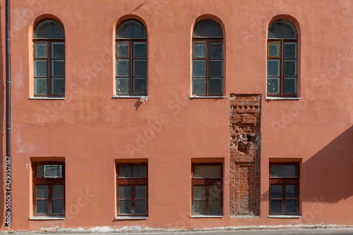 Wall of an old building with opens of brick Mansory.