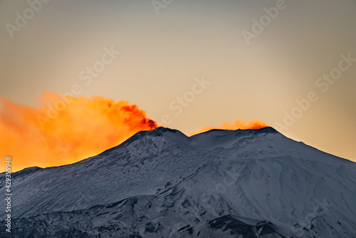 Red glow on the top of Mt Etna during sunset 