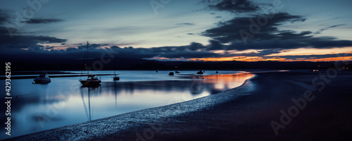 Sunset reflection during the blue hour on a beach near Whakatane, New Zealand