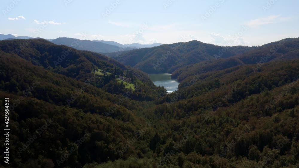 Aerial view of a lake through the mountains in Italy
Aerial view of a lake through the mountains in Italy