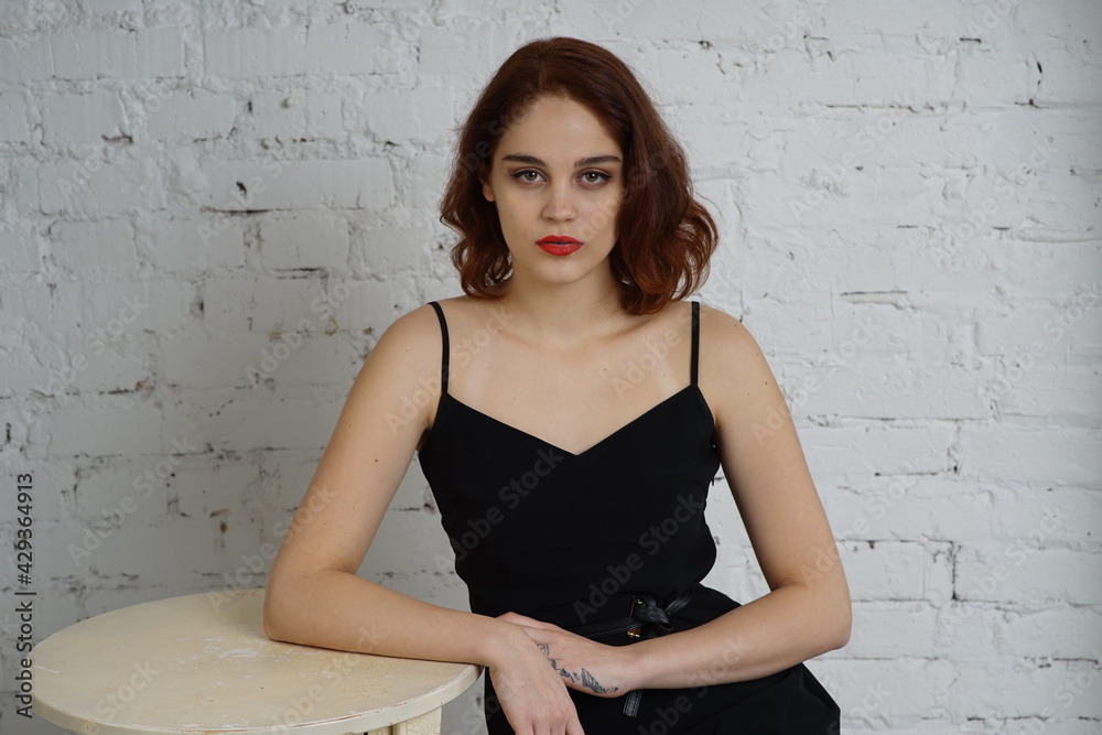 Photo of a young beautiful girl in a photo studio