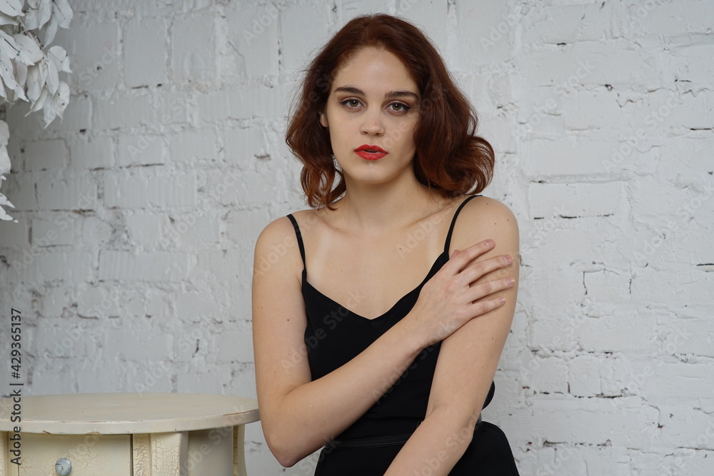 Photo of a young beautiful girl in a photo studio Photo of a young beautiful girl in a photo studio