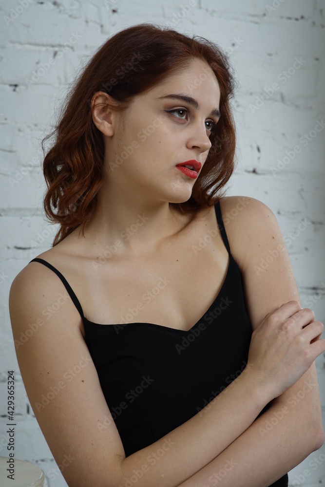 Photo of a young beautiful girl in a photo studio Photo of a young beautiful girl in a photo studio