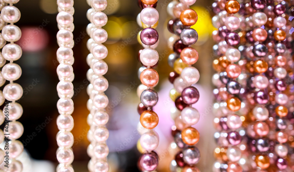 Pearl beads on a pink counter Pearl beads on a pink counter