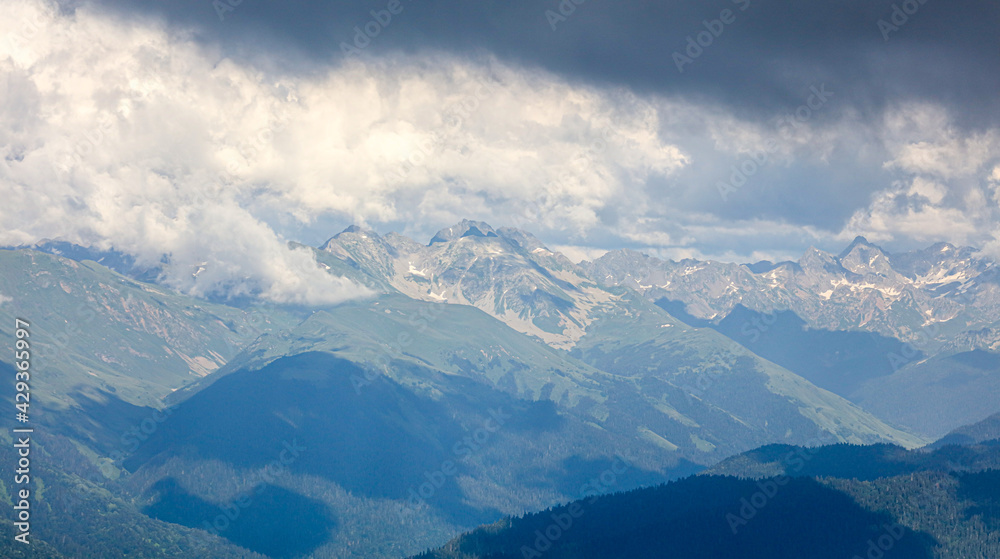 Caucasus mountains in the clouds.