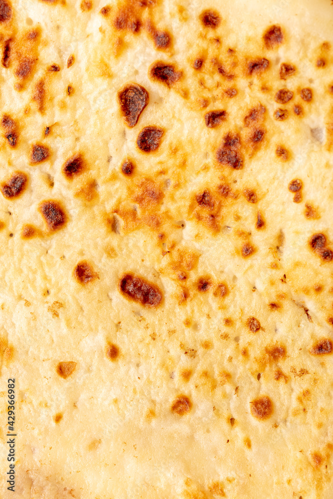 Fried pancake as an abstract background.