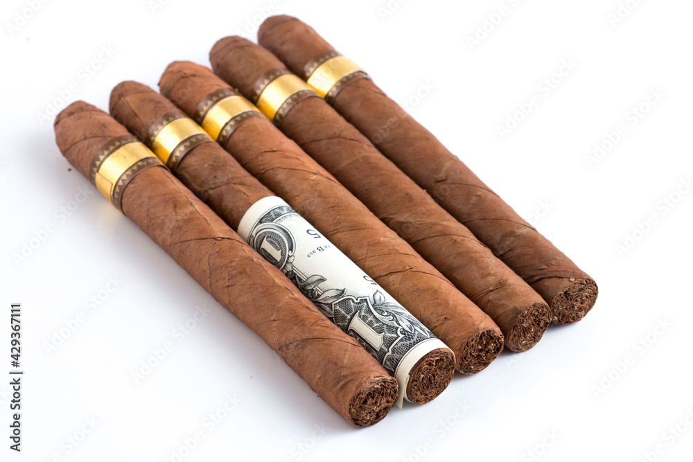 A concept of smoking costs with Rolled Doller bill stock photo A concept of smoking costs with Rolled Doller bill stock photo