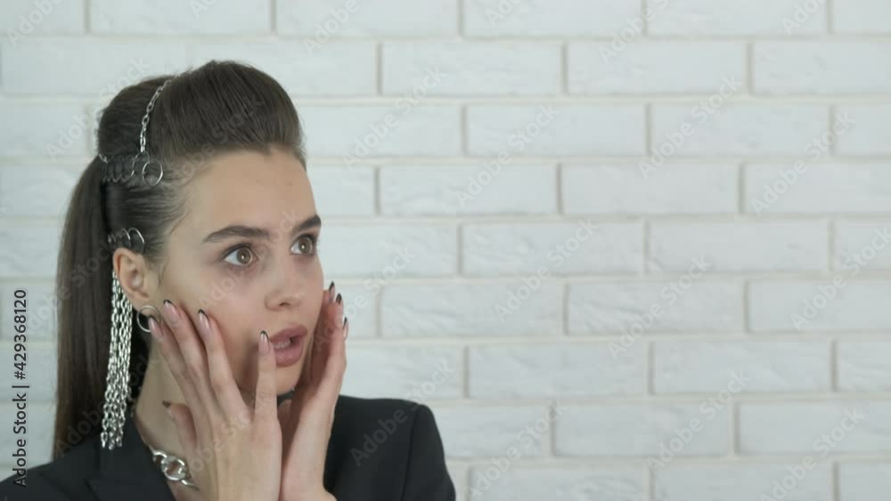 Fashion surprise indoor. A nice good looking model makes a surprise face in the room.