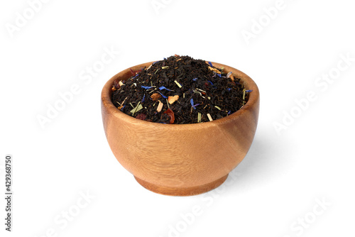 Black tea with rosehip and apple in wooden bowl isolated on white background.