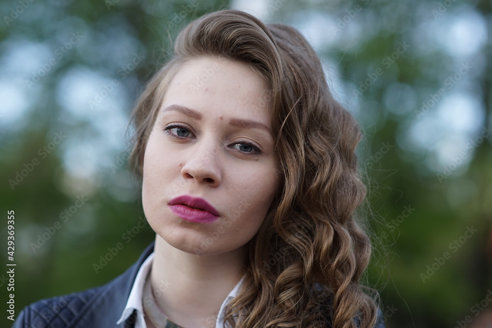 Portrait of a young beautiful girl in the park Portrait of a young beautiful girl in the park