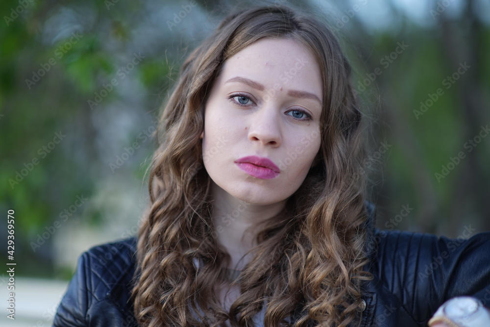 Portrait of a young beautiful girl in the park Portrait of a young beautiful girl in the park