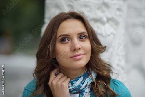 Portrait of a young beautiful girl in the park