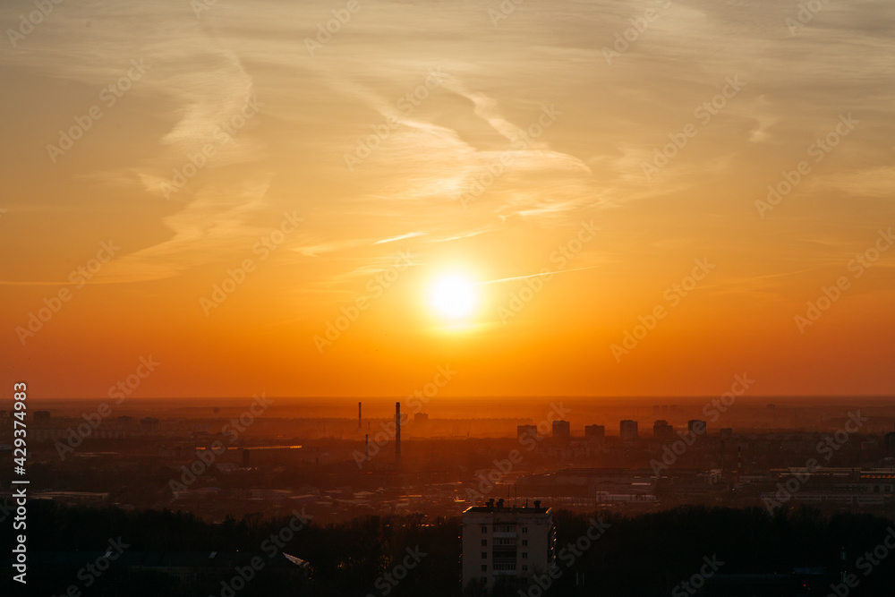 Beautiful golden sunset over the city, panoramic view