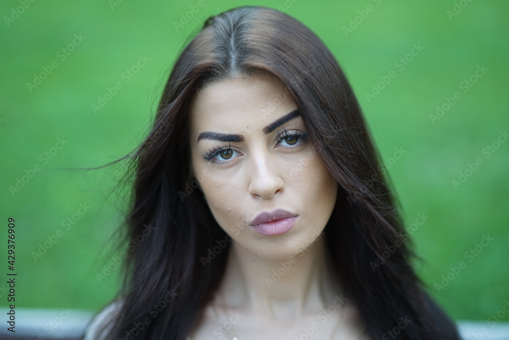 Portrait of a young beautiful girl in the park Portrait of a young beautiful girl in the park