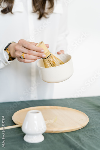 Woman Making a Cup of Japanese Matcha, Green Tea