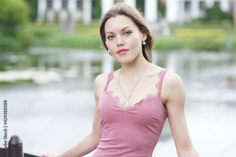 Portrait of a young beautiful girl in the park