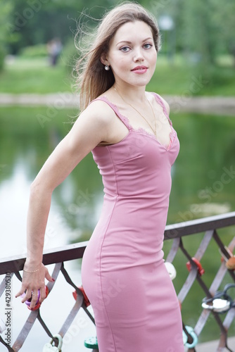 Portrait of a young beautiful girl in the park © Andrey