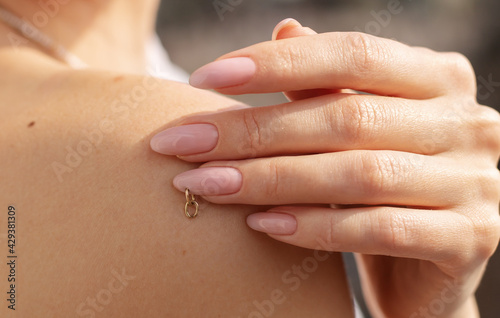 Beautiful female hands with pink manicure